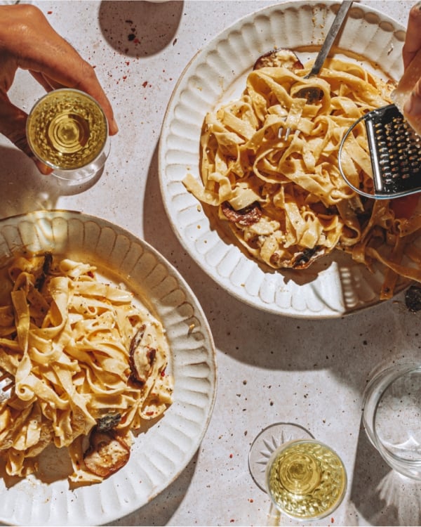 A pair of people enjoying fresh pasta at Saint Bibiana in Savanah